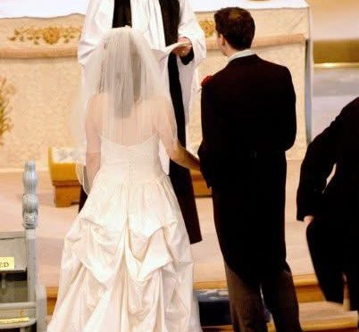 A picture of a couple getting married inside a church